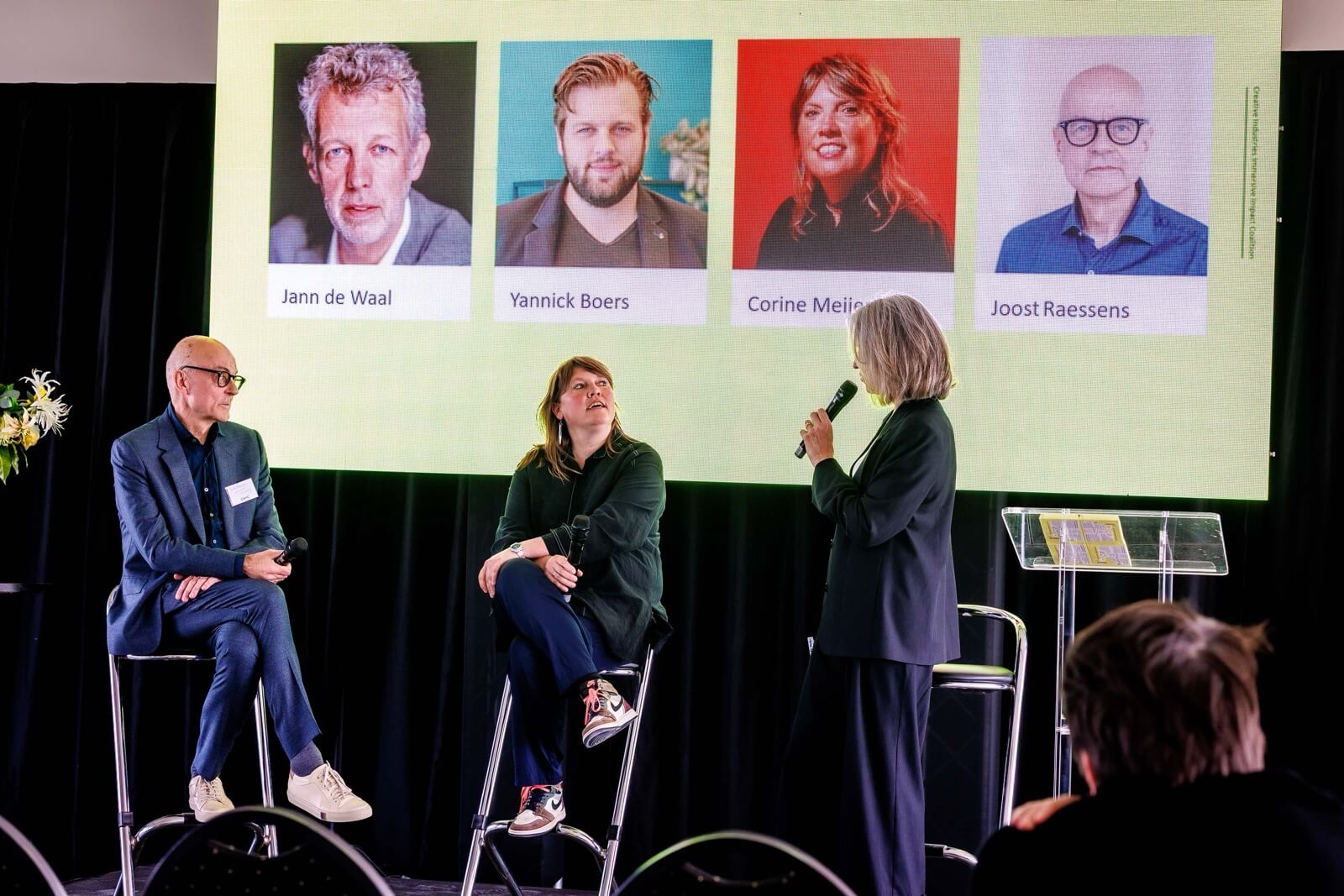 On stage, from left to right: Joost Raessens, Corinne Meijer, and Heleen Rouw.